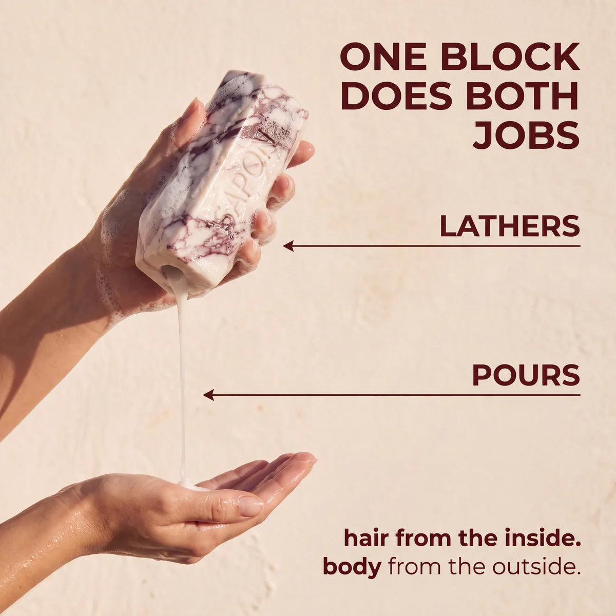 Hands pouring shampoo out of a lathered Sapone bottle, showing that the bottle itself is soap for the body while the shampoo inside is for the hair.