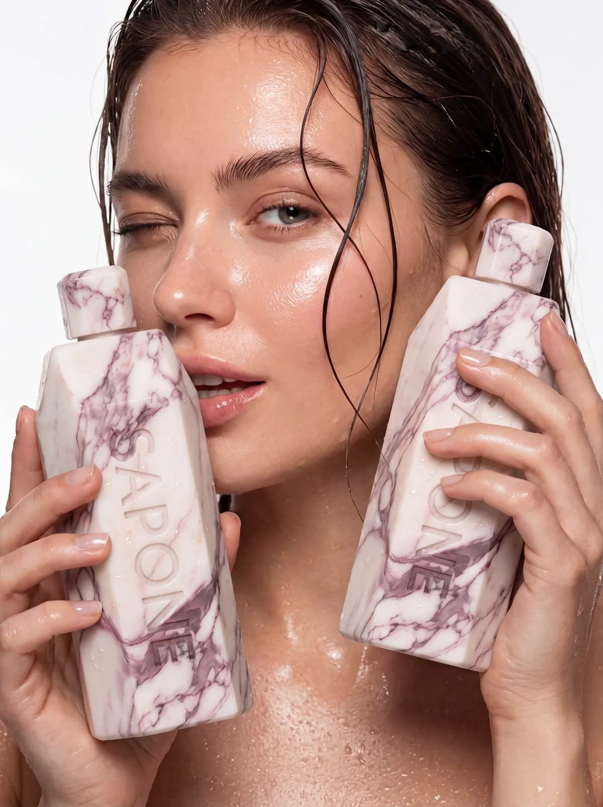 Two Sapone shells held against wet skin